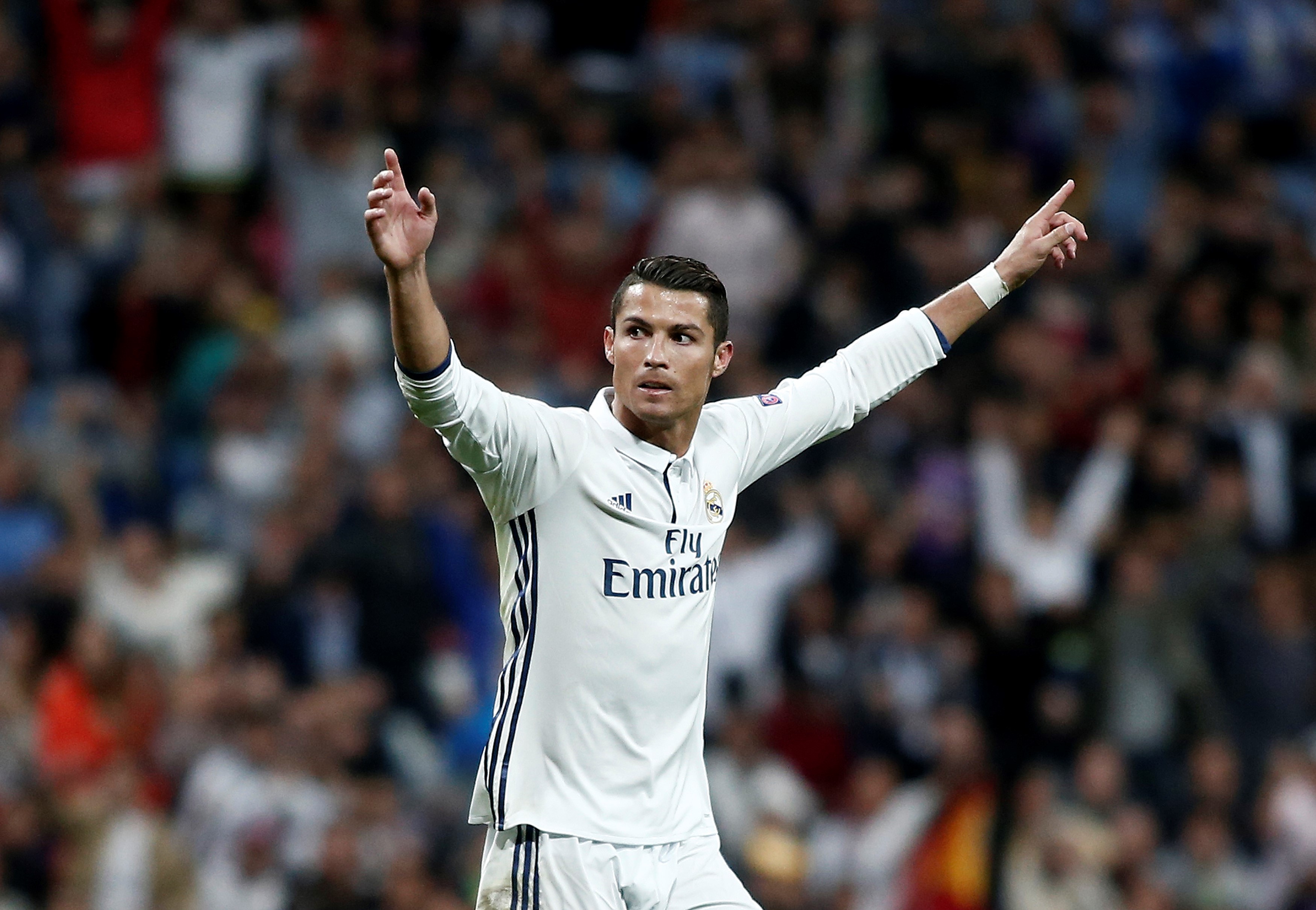 MADRID, SPAIN - SEPTEMBER 14 : Cristiano Ronaldo (7) of Real Madrid celebrates his score with his team mates during UEFA Champions League Group F match between Real Madrid and Sporting Lisbon at Santiago Bernabeu Stadium in Madrid, Spain on September 14, 2016. (Photo by Burak Akbulut/Anadolu Agency/Getty Images)