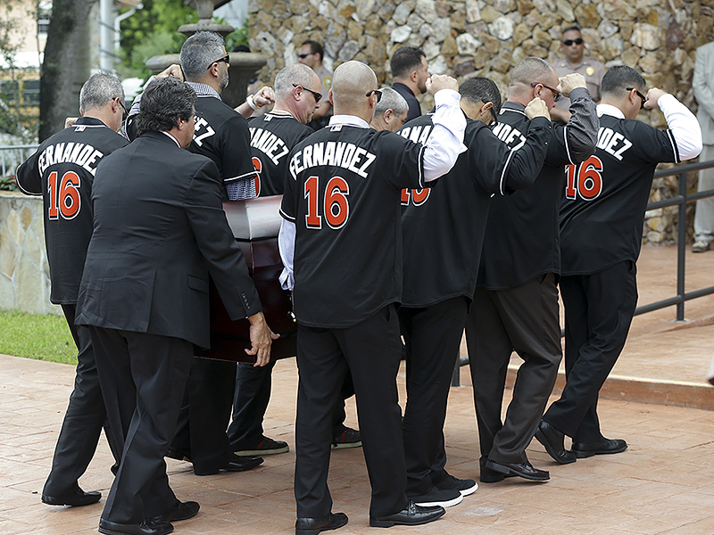 Pallbearers wear a No. 16 jersey in honor of Miami Marlins pitcher Jose Fernandez as they carry his casket for a memorial service at St. Brendan's Catholic Church, Thursday, Sept. 29, 2016, in Miami. Fernandez was killed in a boating accident Sunday along with two friends. (AP Photo/Lynne Sladky)