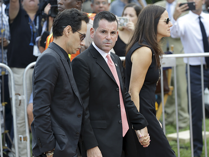 Miami Marlins president David Samson, center, and musician Marc Anthony, left, arrive for a memorial service for Miami Marlins pitcher Jose Fernandez at St. Brendan's Catholic Church, Thursday, Sept. 29, 2016, in Miami. Fernandez was killed in a boating accident Sunday along with two friends. (AP Photo/Lynne Sladky)