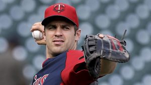 Minnesota's Joe Mauer throws before a baseball game against the Detroit Tigers in Detroit, Tuesday, Aug. 20, 2013. Mauer was scratched from the lineup against the Tigers because he experienced dizziness Tuesday night in batting practice, and is now on the team's 7-day concussion disabled list. (AP Photo/Paul Sancya)