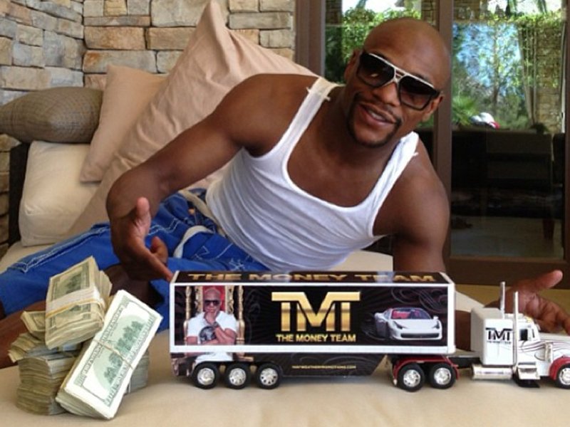 9-his-the-money-team-hess-truck-next-to-stacks-of-cash