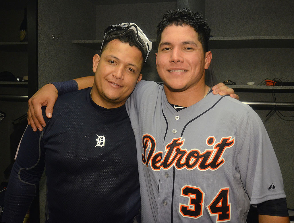 OAKLAND, CA - OCTOBER 11: Miguel Cabrera #24 and Avisail Garcia #34 of the Detroit Tigers pose for a photo during the clubhouse celebration after the victory in Game Five of the American League Division Series against the Oakland Athletics at Oakland-Alameda County Coliseum on October 11, 2012 in Oakland, California. The Tigers defeated the A's 6-0. (Photo by Mark Cunningham/MLB Photos via Getty Images)