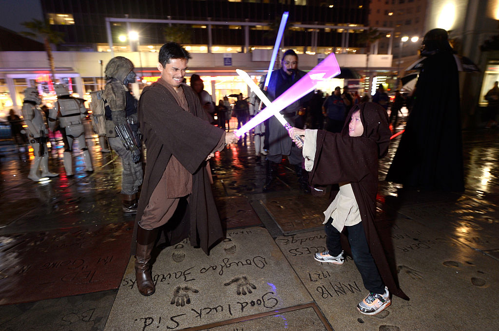 HOLLYWOOD, CA - DECEMBER 15:  Star Wars fans interact with performers at the Opening Night Celebrations of Walt Disney Pictures and Lucasfilm's "Rogue One: A Star Wars Story" at The TCL Chinese Theatre on December 15, 2016 in Hollywood, California.  (Photo by Kevork Djansezian/Getty Images)