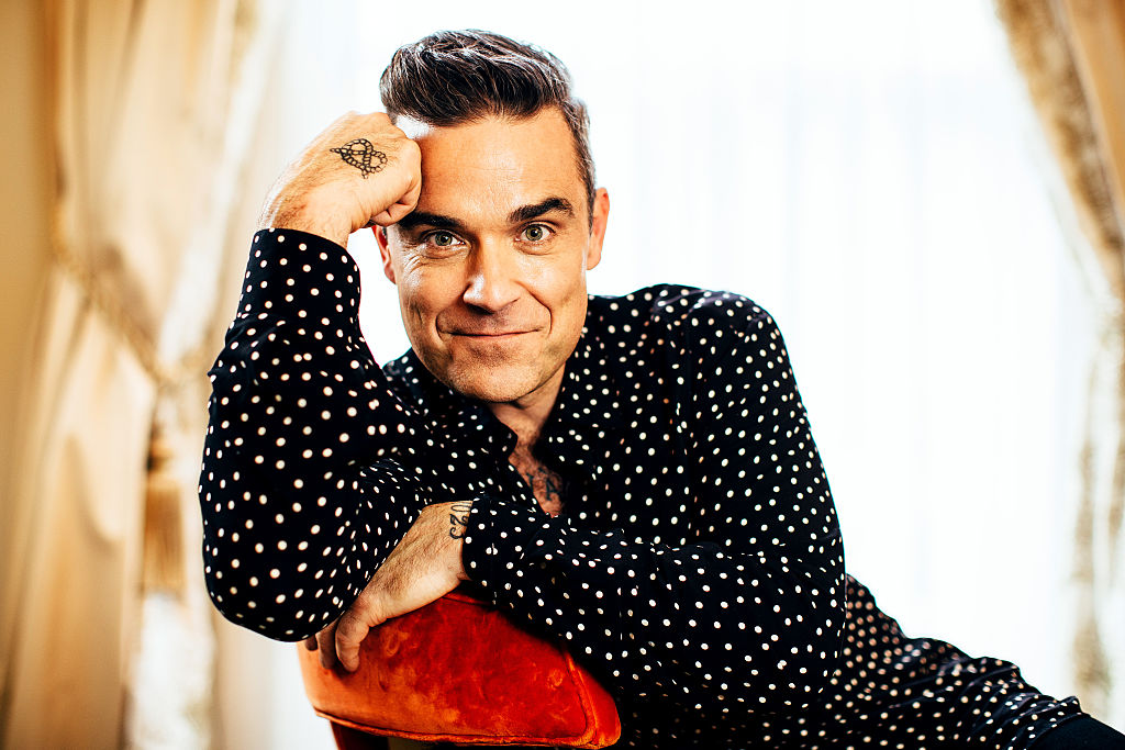 SYDNEY, AUSTRALIA - NOVEMBER 21: (EUROPE AND AUSTRALASIA OUT) Singer Robbie Williams poses during a photo shoot at the Langham in Sydney, New South Wales. (Photo by Jonathan Ng/Newspix/Getty Images)